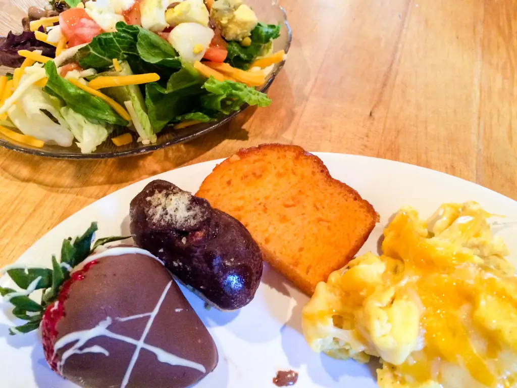 My final round of this Hofbrau Sunday brunch included a salad, scrambled eggs topped with cheese, sweet orange bread, mini eclair and a chocolate-covered strawberry. Yum! (Photo by Erin Klema)