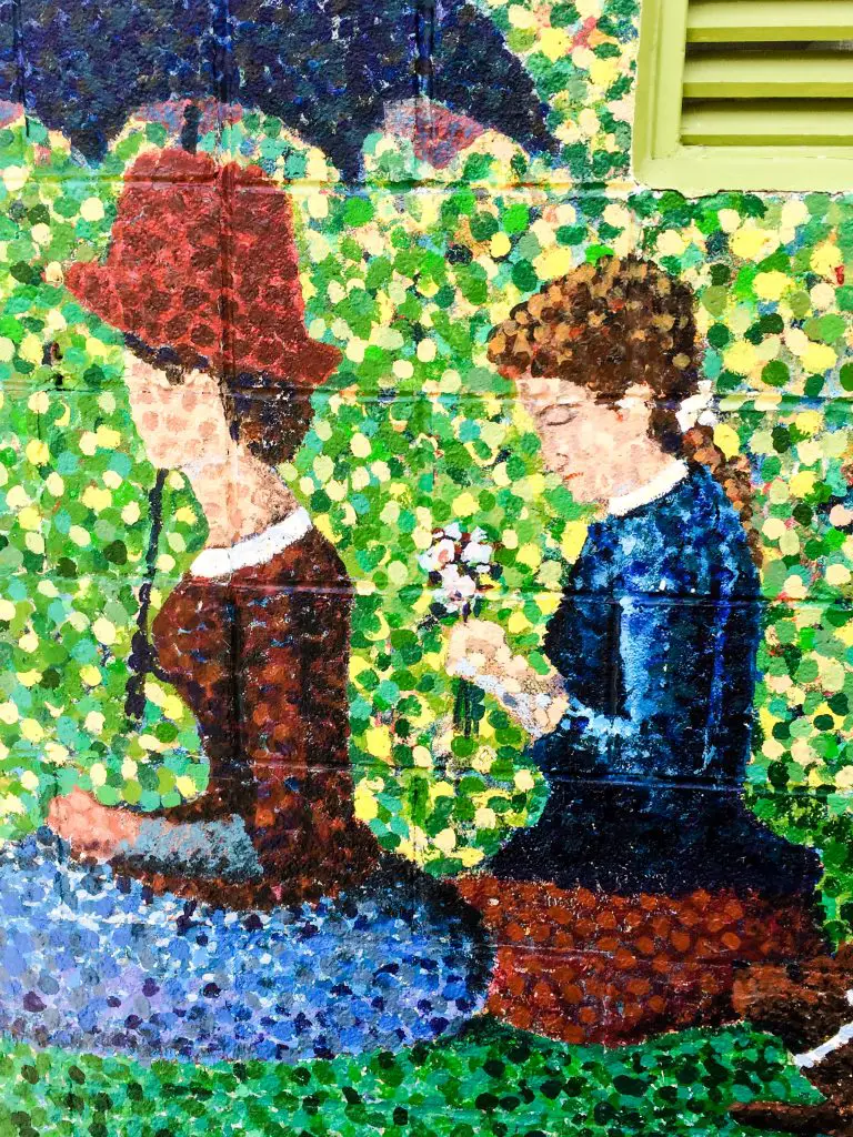 Pointillism mural of two women in Saugatuck, Michigan