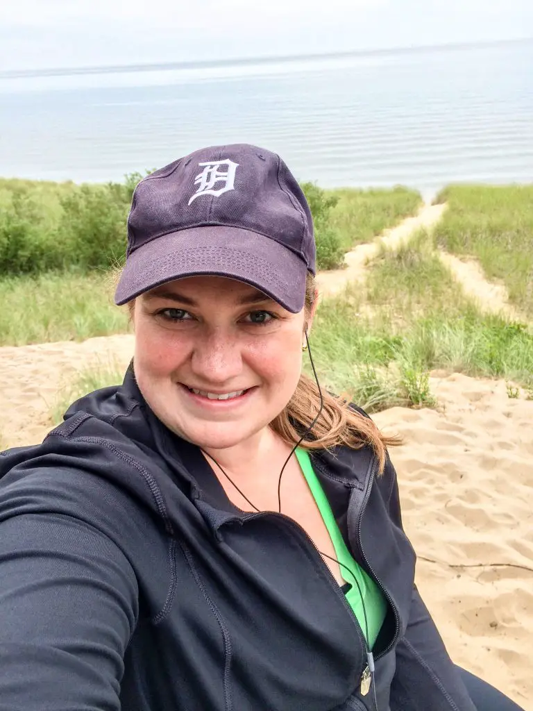 A young Michigan woman takes a selfie at Saugatuck Dunes State Park in Saugatuck, Michigan.