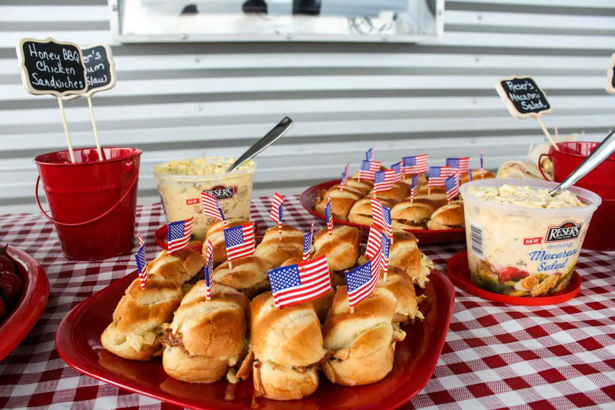 At a #SlawSocial, these honey BBQ chicken sliders topped with Reser's Stadium Cole Slaw were a hit! Get the easy, slow-cooker recipe on EpicureanTravelerBlog.com! #LetsEat #ResersInGR