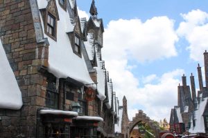 Snow-covered shops in Hogsmeade village in the Wizarding World of Harry Potter - Hogsmeade at Islands of Adventure, Universal Orlando Resort