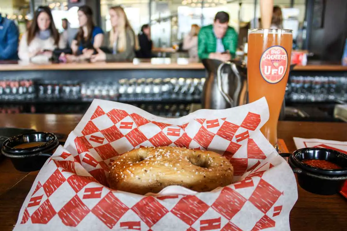 Handmade pretzel and a UFO Big Squeeze Shandy in the beer hall at Harpoon Brewery in Boston, Massachusetts, USA