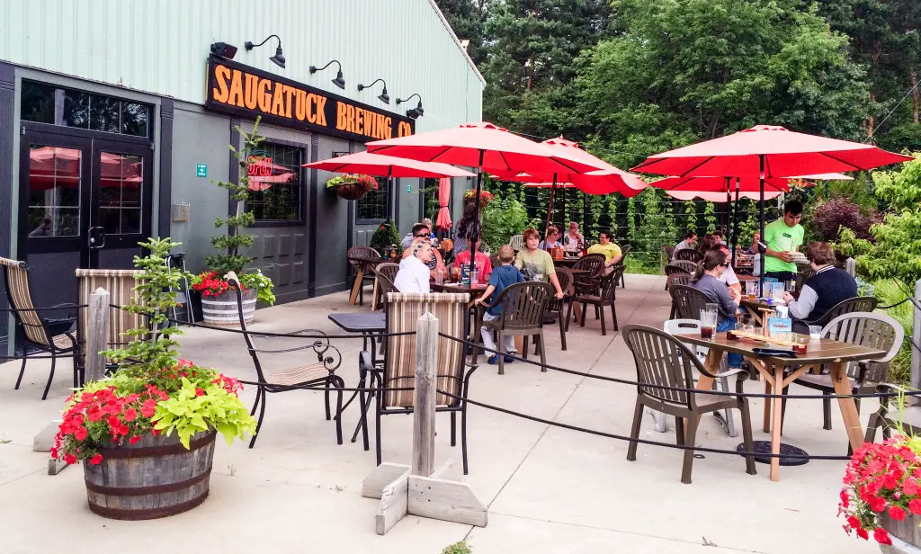 Diners drink craft beer on the patio of Saugatuck Brewing Co. in Saugatuck, Michigan.