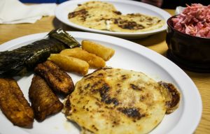 Pupuseria El Salvador pupusas, yuca fritas, tamale, and fried plantains