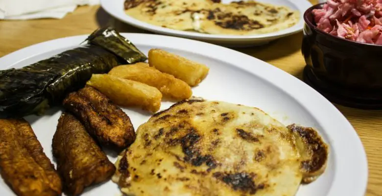 Pupuseria El Salvador pupusas, yuca fritas, tamale, and fried plantains