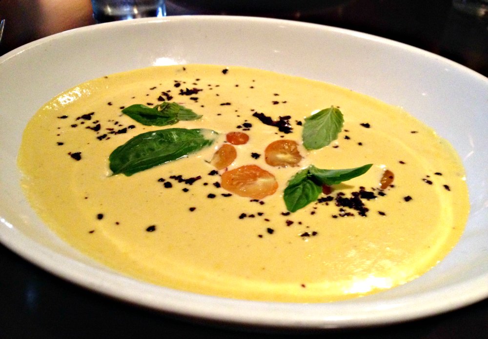 Seasonal corn bisque garnished with yellow cherry tomatoes, olive salt and mint leaves at Grove in Grand Rapids | The Epicurean Traveler