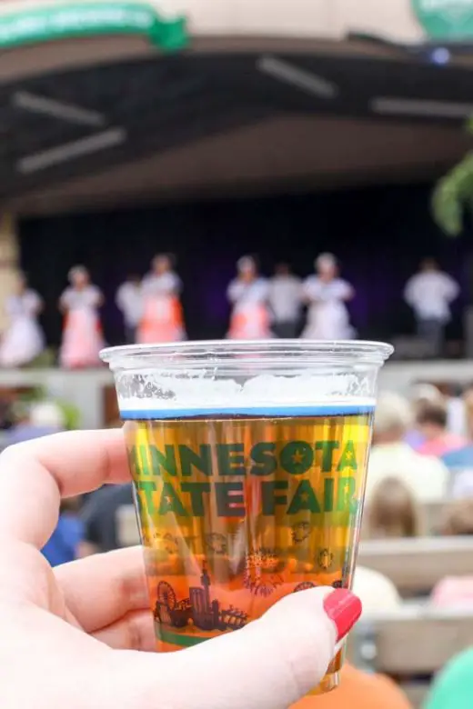 Woman's hand holds a craft beer at the Minnesota State Fair