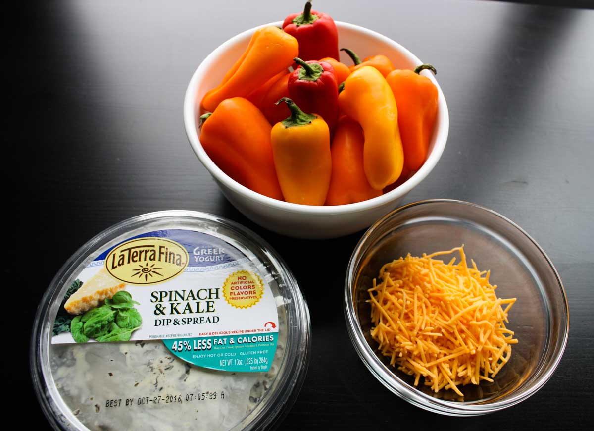 Ingredients for stuffed sweet peppers: Mini sweet peppers, shredded cheddar cheese, and the La Terra Fina Dip & Spread of your choice