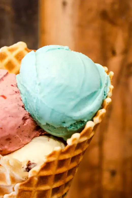 Waffle cone with three ice cream scoops