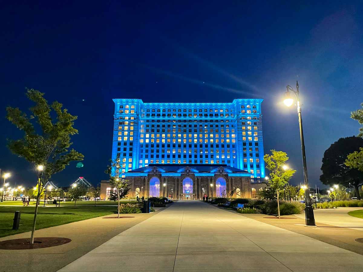 Michigan Central Station lit in Honolulu Blue light on a September 2024 evening