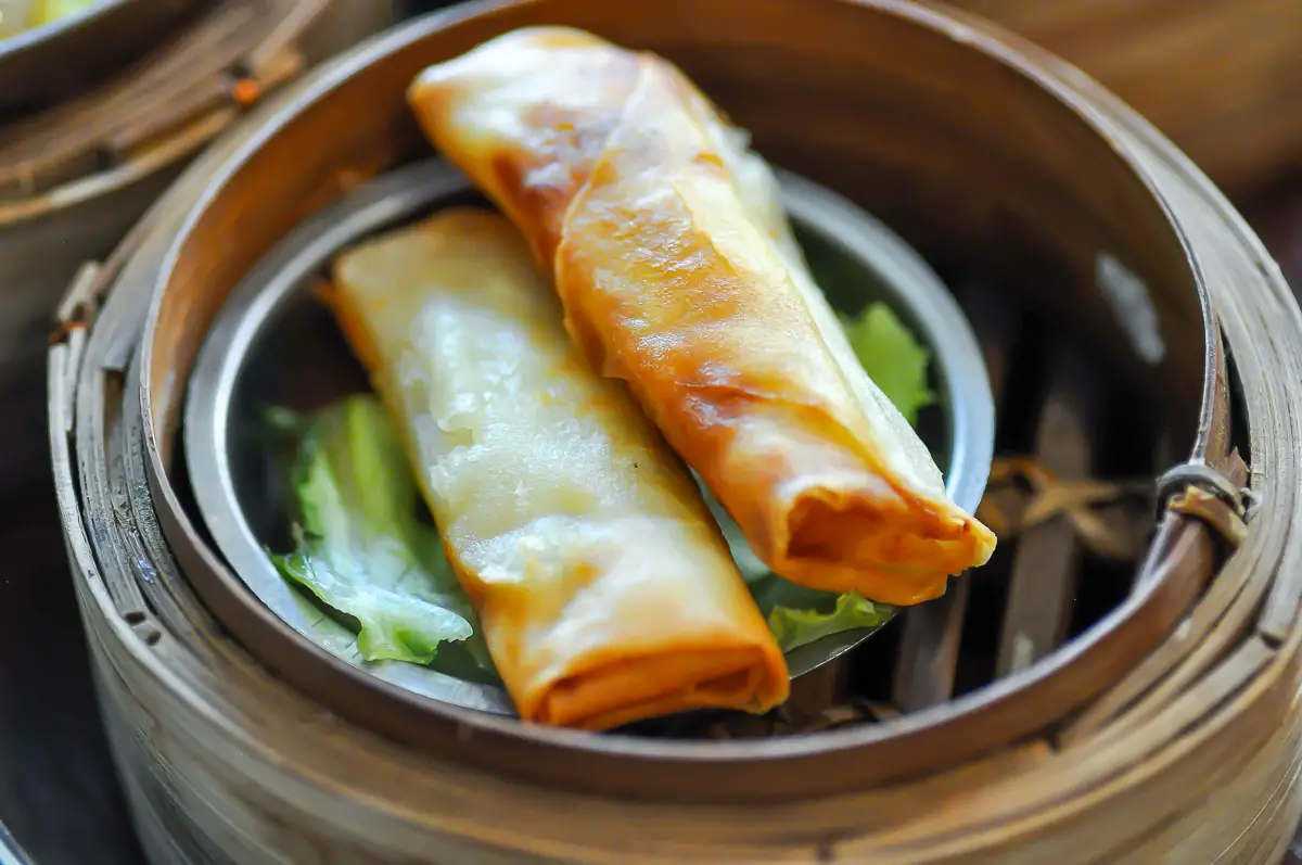 Deep-fried spring rolls in bamboo dim-sum basket