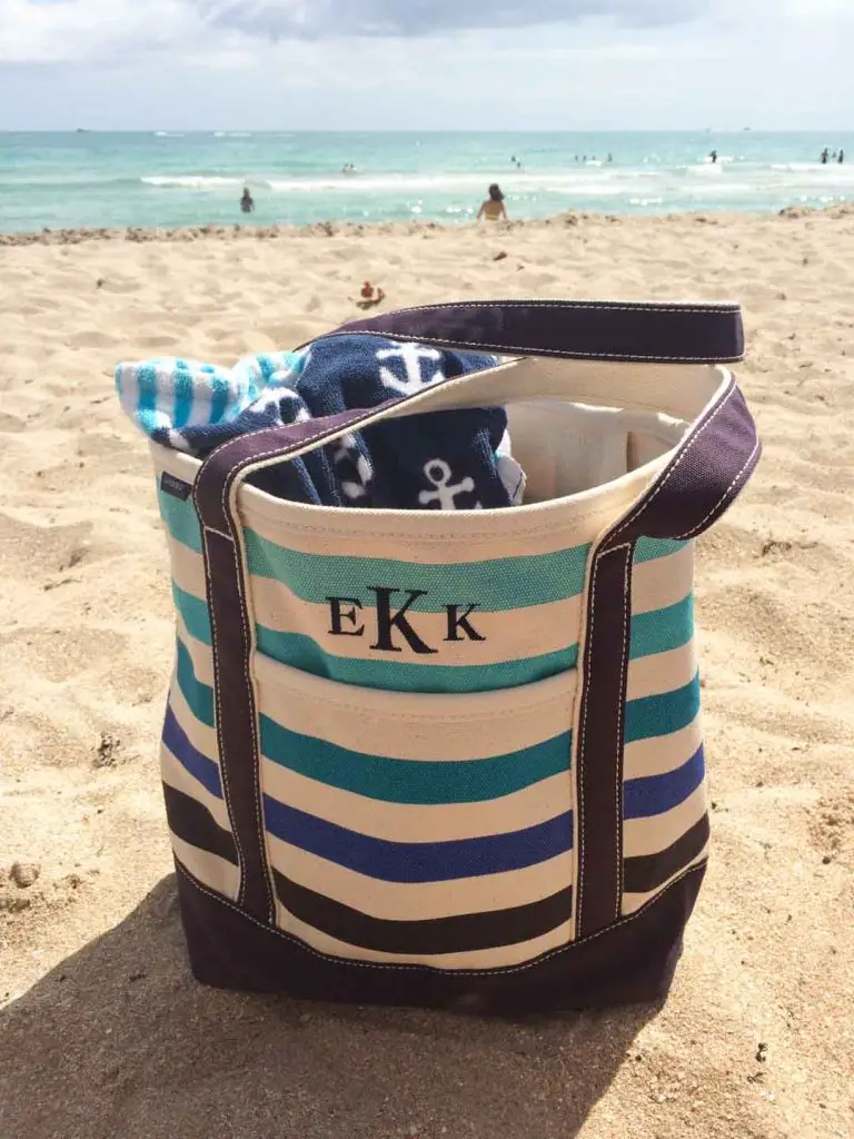 Lands' End Canvas Tote sits on the sand at a beach in Surfside, Florida