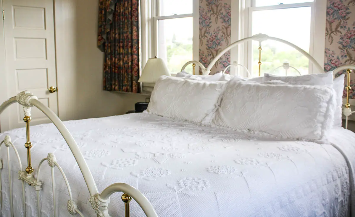 Bed in a historic guest room at the Hotel Boulderado in Boulder, Colorado, USA