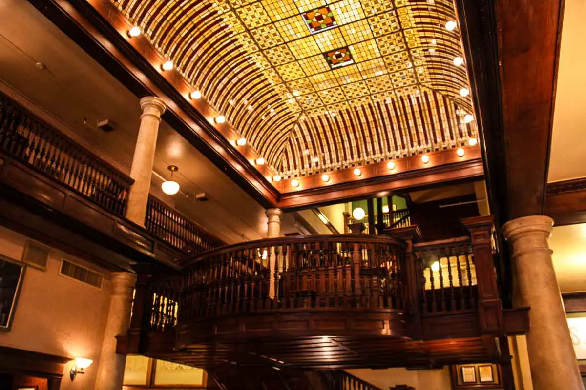 The grand staircase and stained-glass ceiling in the lobby of the historic Hotel Boulderado in Boulder, Colorado, USA