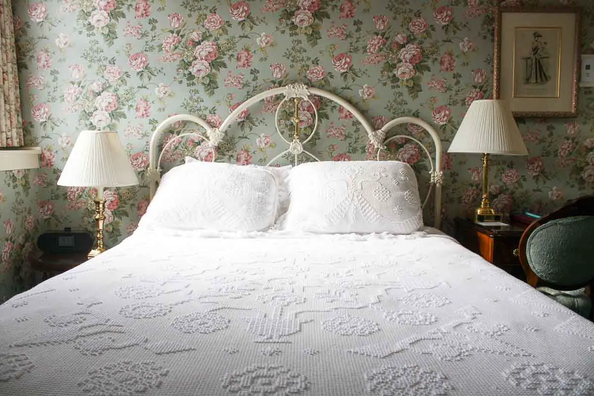 Guest room bed with bedside lamps in the historic Hotel Boulderado in Boulder, Colorado