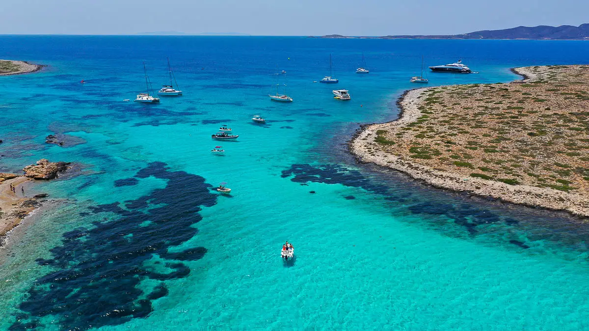 Aerial drone photo of Panteronisia, also known as the Blue Lagoon, a small islet between Paros and Antiparos, in Greece