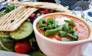 Roasted red pepper soup with rainbow salad and pita bread at Wild Goose Meeting House in Colorado Springs, Colorado