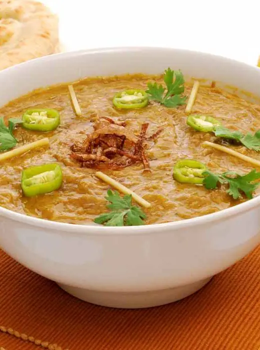 White bowl of haleem, a traditional Pakistani dish