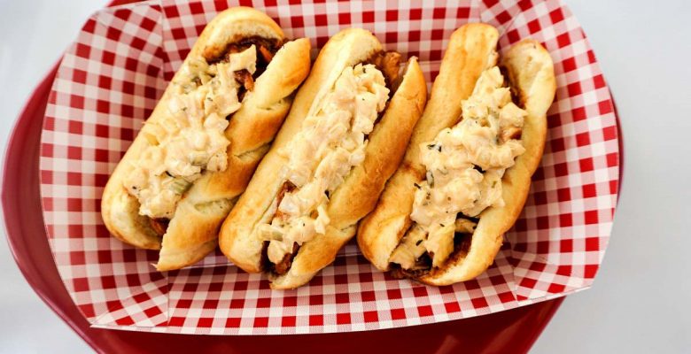 Easy Crock-Pot Recipe: Honey BBQ chicken sandwiches topped with Reser's Stadium Cole Slaw in brioche rolls