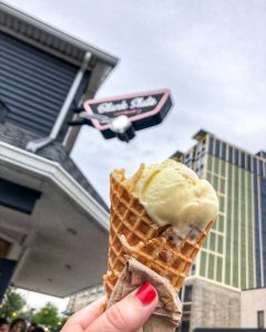 Lavender lemon honey ice cream in a waffle cone outside Blank Slate Creamery in Ann Arbor, Michigan