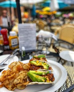 Halibut tacos with chips on the patio of Knight's Steakhouse, a restaurant, in Ann Arbor, Michigan, USA