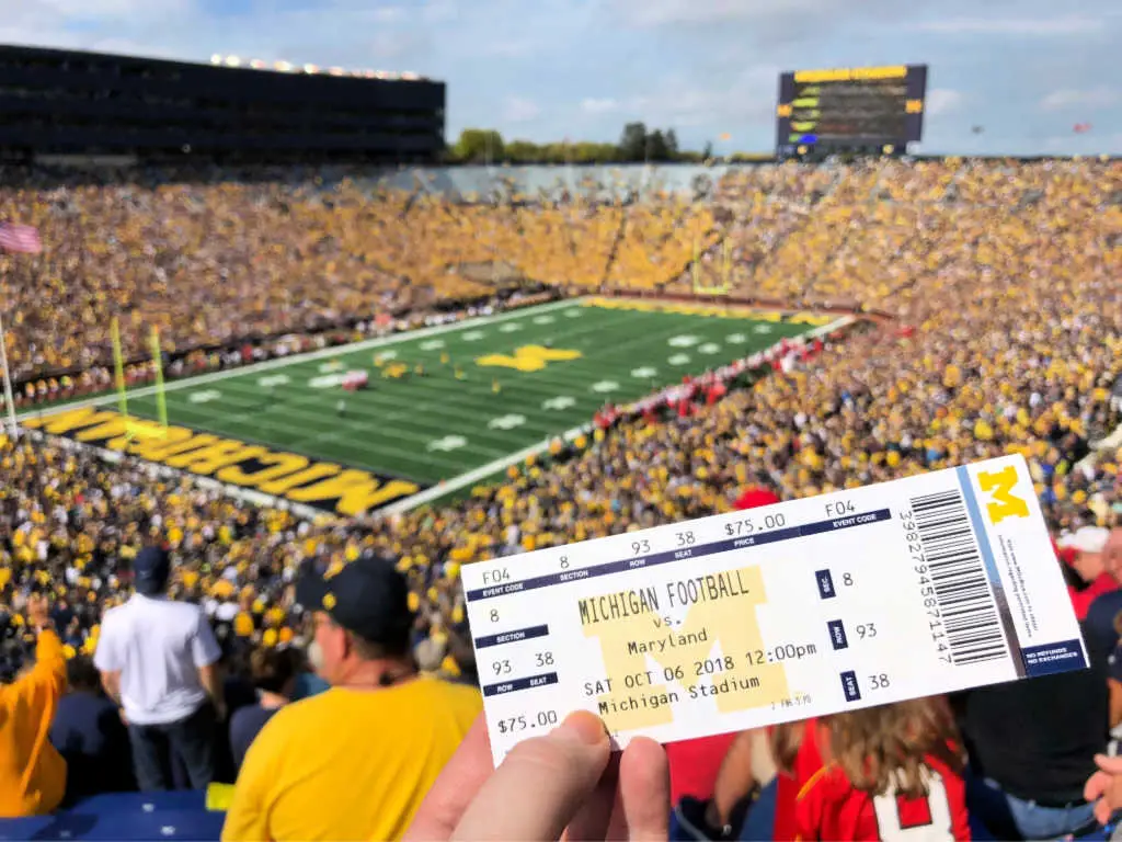A college football fan holds up their ticket to Michigan Wolverines game against Maryland on Oct. 6, 2018 at Michigan Stadium, also known as The Big House, in Ann Arbor, Michigan, USA. 