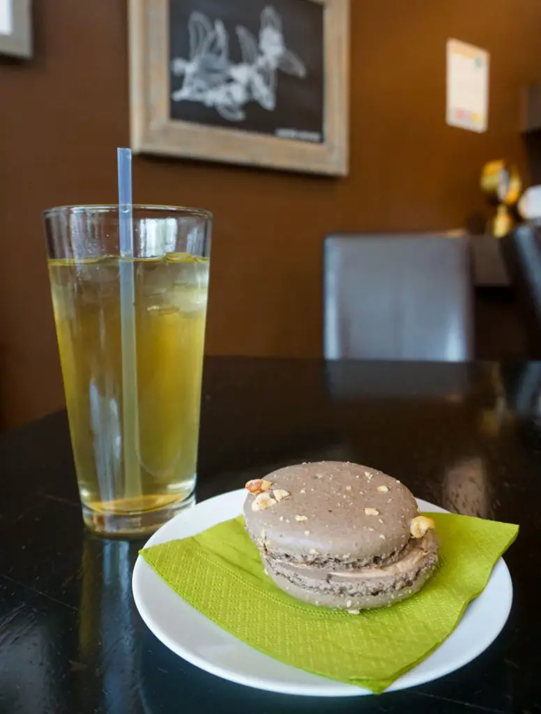 Hazelnut French macaron and iced strawberry and star fruit tea at TeaHaus in Ann Arbor, Michigan