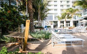 Poolside lounge chairs and hammock at Grand Beach Hotel Surfside in Surfside, Florida