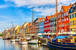 Copenhagen Nyhavn port with colorful buildings and sailboats