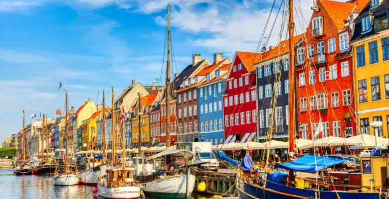 Copenhagen Nyhavn port with colorful buildings and sailboats
