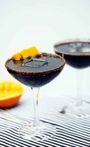 Midnight mango margaritas Halloween cocktail with activated charcoal powder