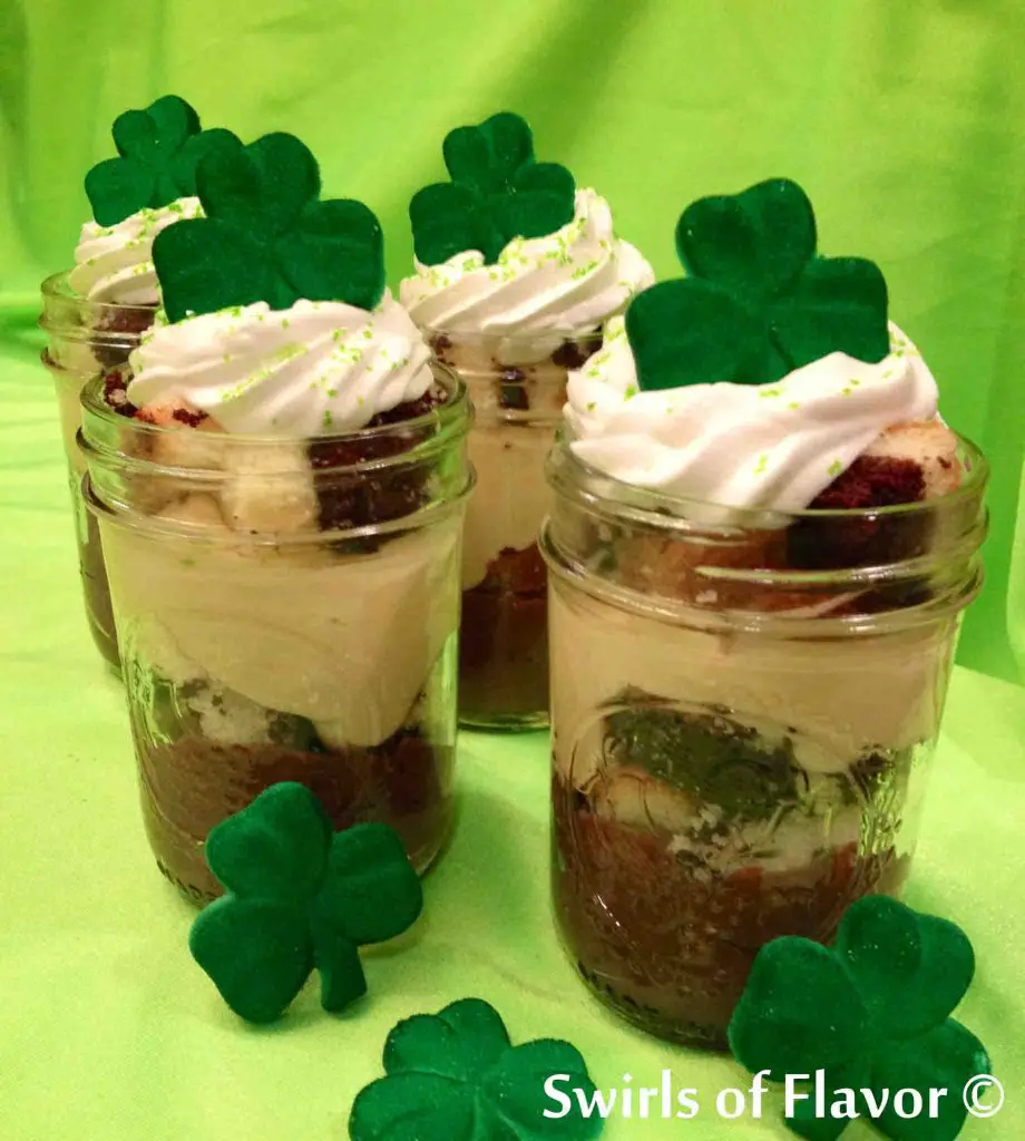 St. Patrick's Day desserts of Irish cream parfaits topped with green shamrocks in lime green setting