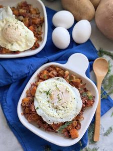 Sweet potato corned beef hash topped with eggs