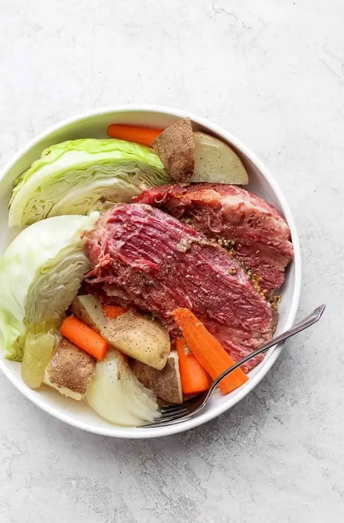 Corned beef and cabbage meal in a white bowl