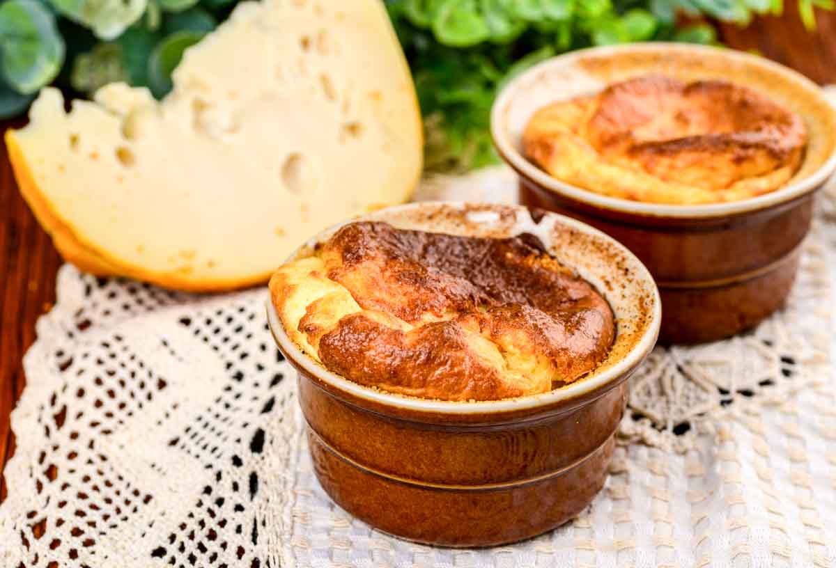 French baked cheese soufflés in brown ramekins