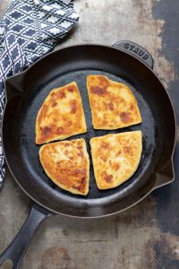 Traditional Irish potato farls in cast iron pan