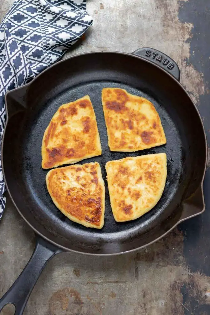 Traditional Irish potato farls in cast iron pan