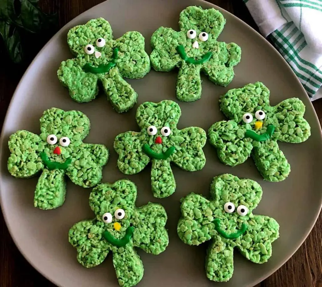 Green shamrock-shaped Rice Krispies treats on a plate