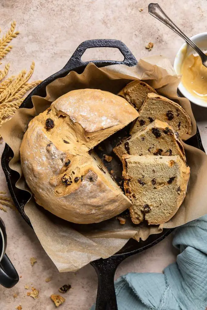 Vegan Irish soda bread with raisins in a rustic setting