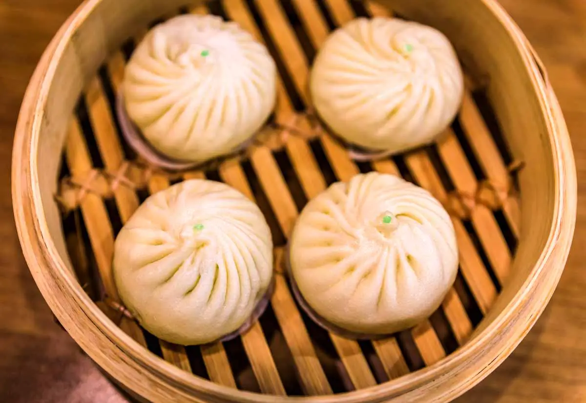 Chinese bao buns in steamer basket at a restaurant in Singapore
