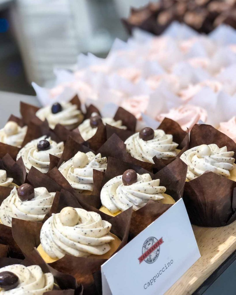 Cappuccino cupcakes in a bakery case at Cakabakery on 8th in Holland, Michigan