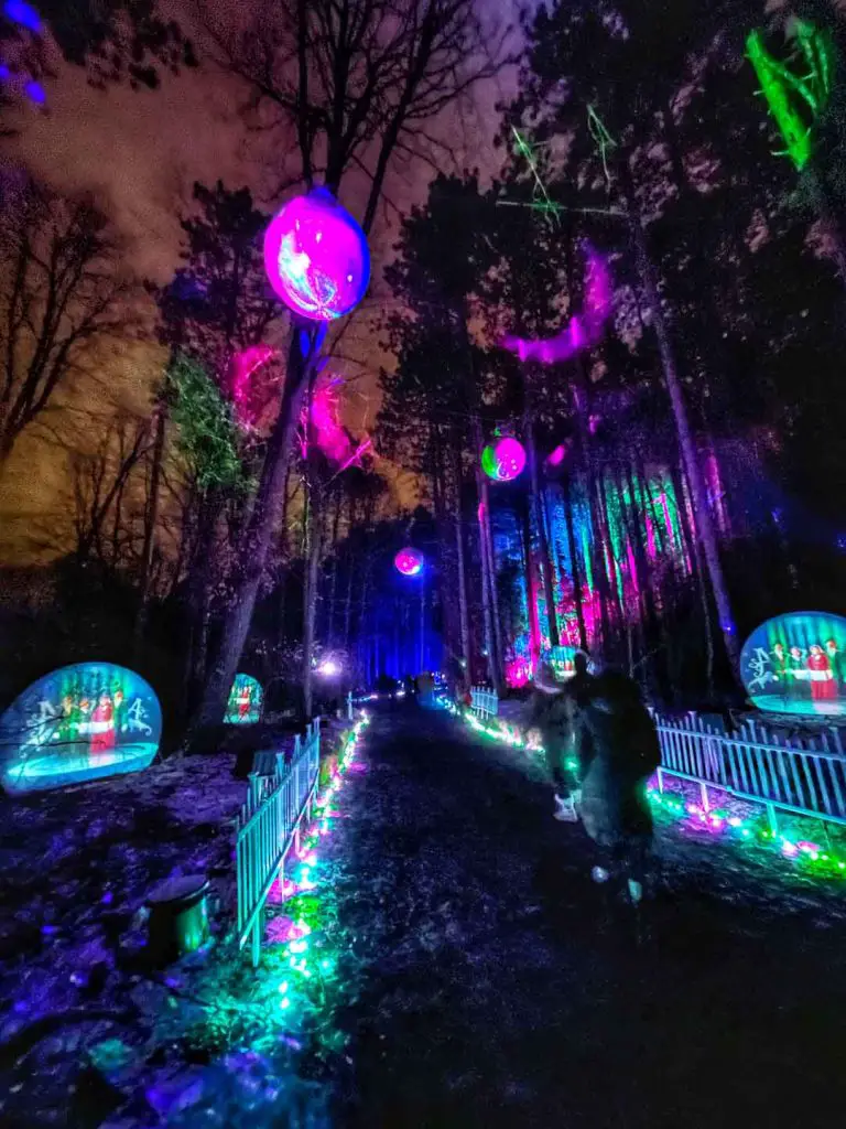 Glenlore Trails Aurora, an immersive holiday light display in an illuminated forest, in Commerce Township, Michigan, USA