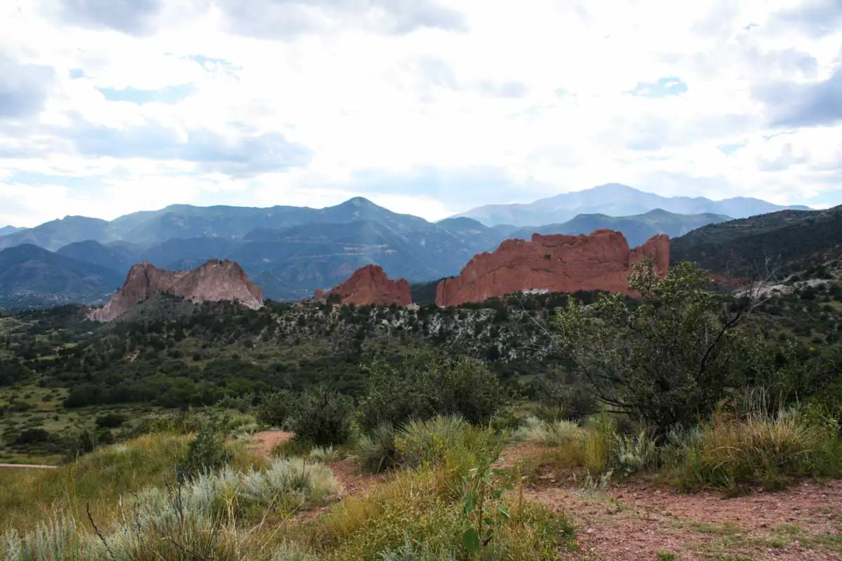 From this viewpoint in Colorado Springs, you can see Garden of the Gods and Pikes Peak in the distance 