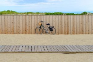 Bicycle parked on a beach on Nantucket Island, Massachusetts, USA