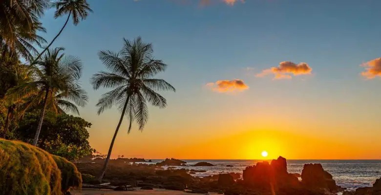 Sunset along the volcanic rock beach of Corcovado National Park in Costa Rica, Central America
