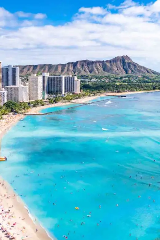 Aerial view of Waikiki Beach iwith Diamond Head in the distance in Honolulu, Hawaii, on the Hawaiian island Oahu