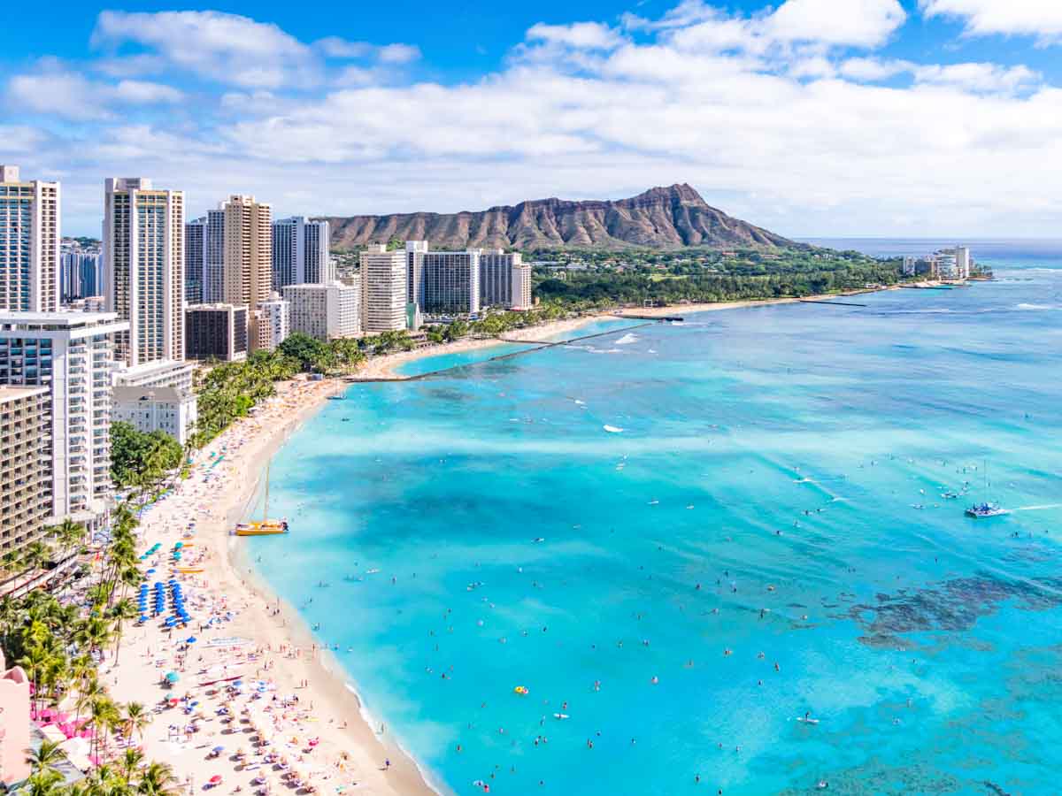 Aerial view of Waikiki Beach iwith Diamond Head in the distance in Honolulu, Hawaii, on the Hawaiian island Oahu