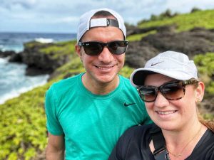 Couple on vacation in Maui sport designer sunglasses with UV protection while hiking at Haleakalā National Park in Hawaii