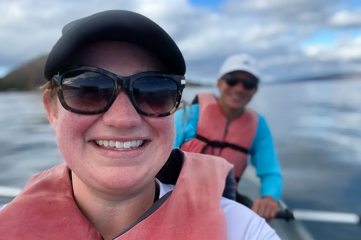 Sunglasses-clad couple kayaks off the coast of Maui in Hawaii