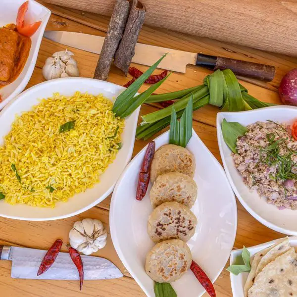 Famous Maldivian cuisine dishes on a wooden table
